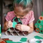 Kids making handmade Christmas advent calendar with toilet paper